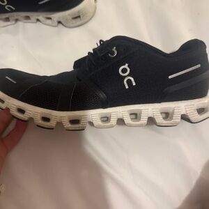 On Running Black and White Athletic Shoes with CloudTec Cushioning